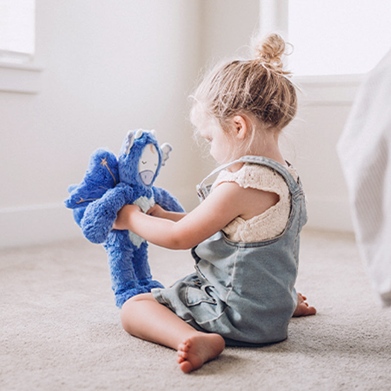 Child playing with Dragon Kin