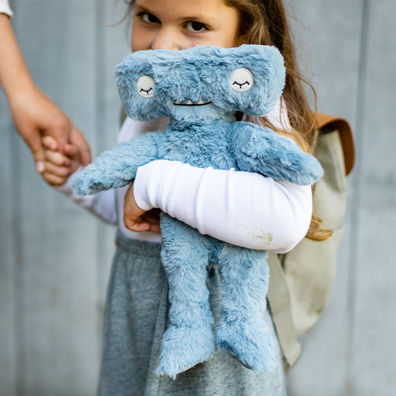 Child holding Hammerhead Kin promoting Conflict Resolution.