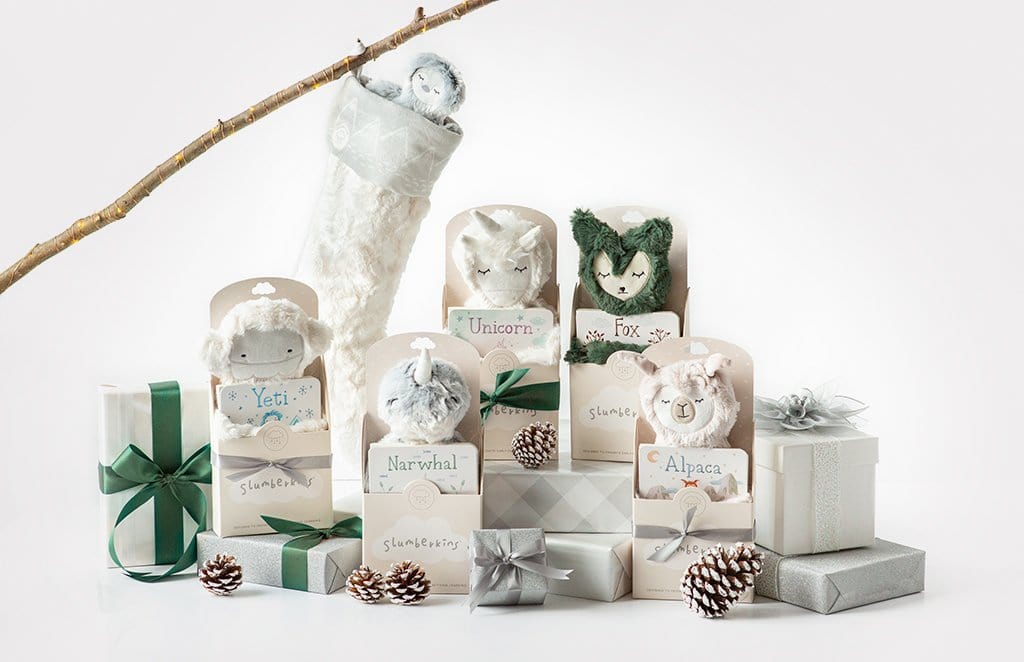 Front view of Slumberkins gift set showing six plush character toys in holiday boxes on a white background