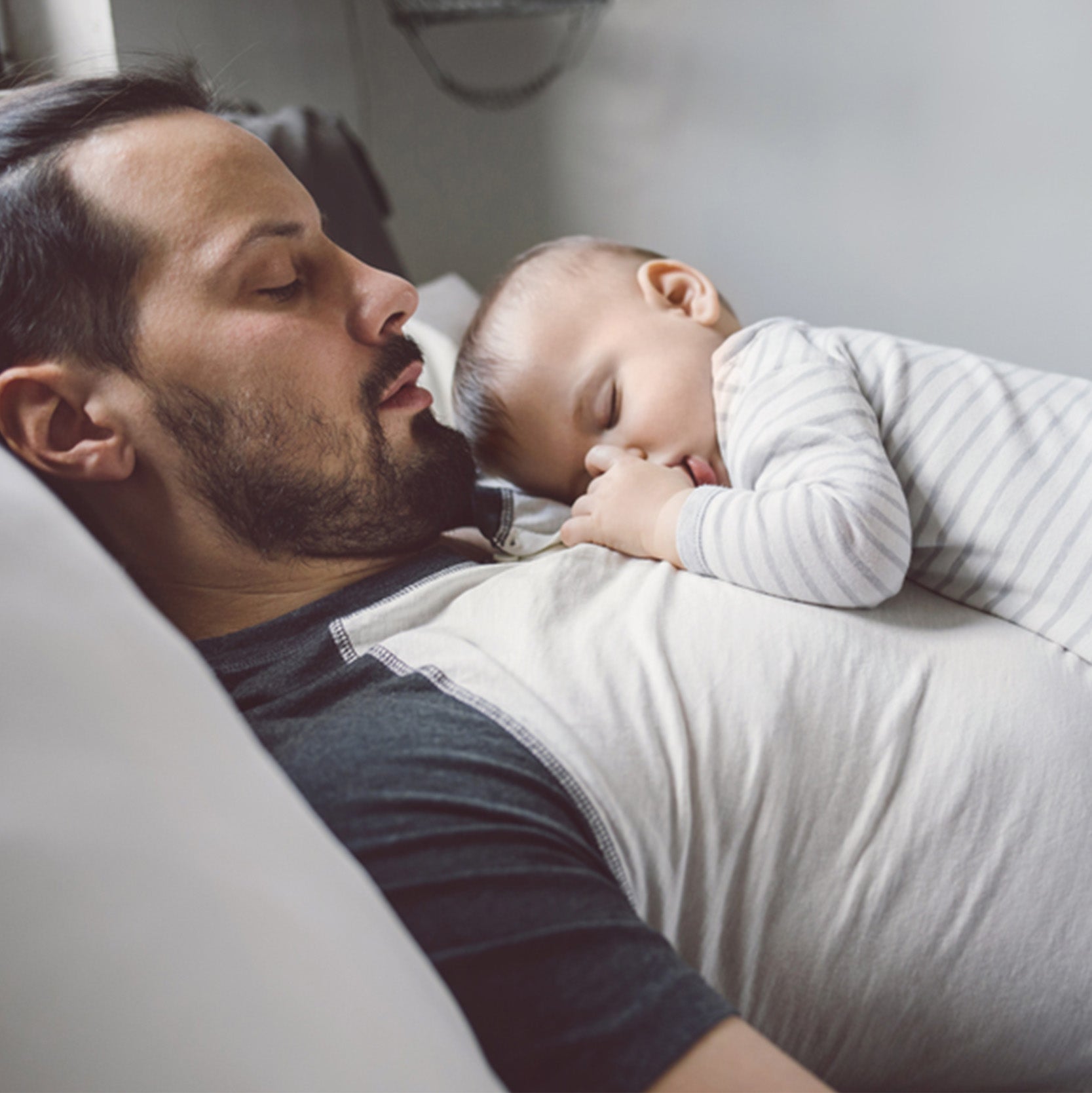 baby sleeping on father's chest