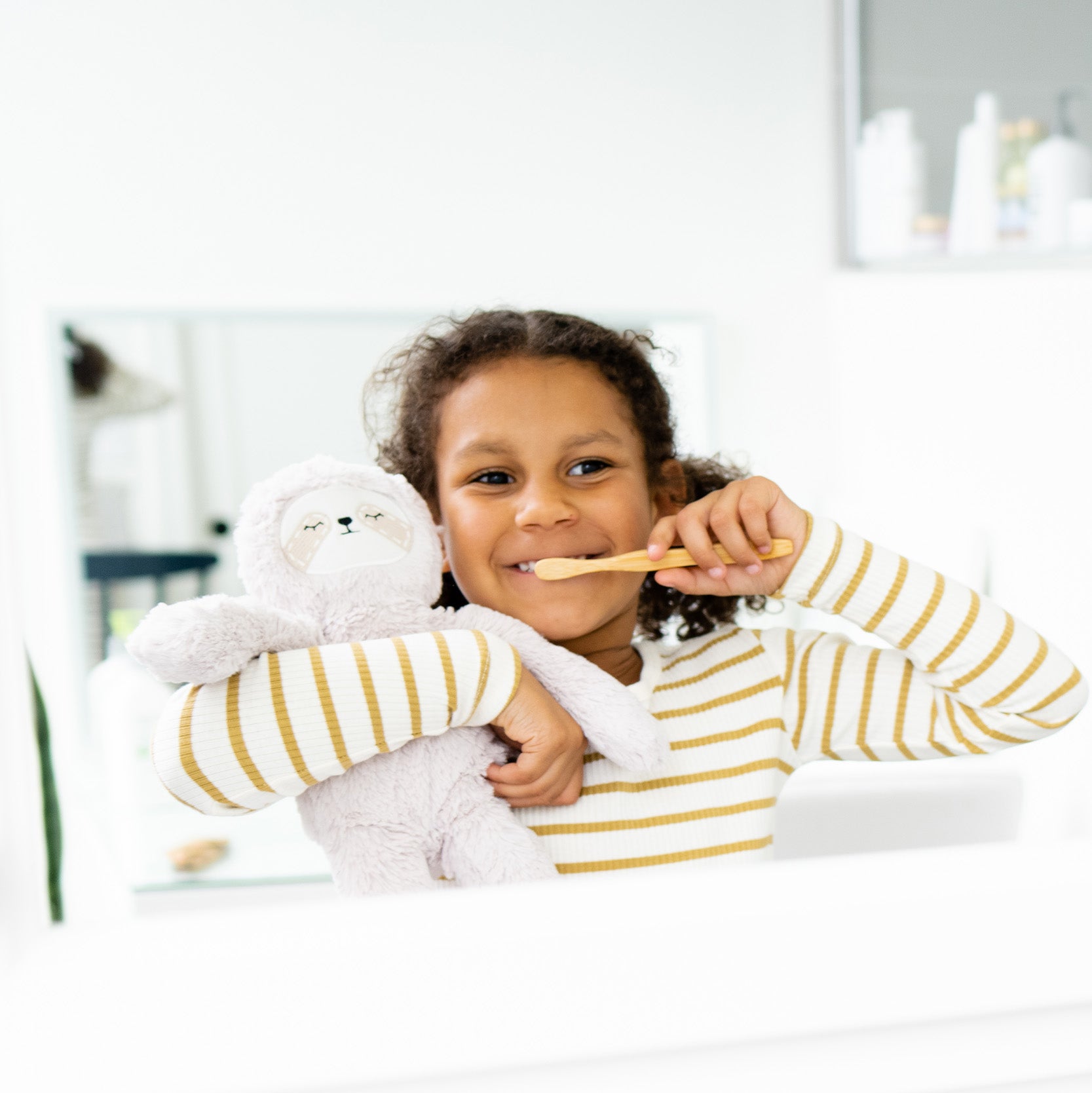 little girl brushing teeth