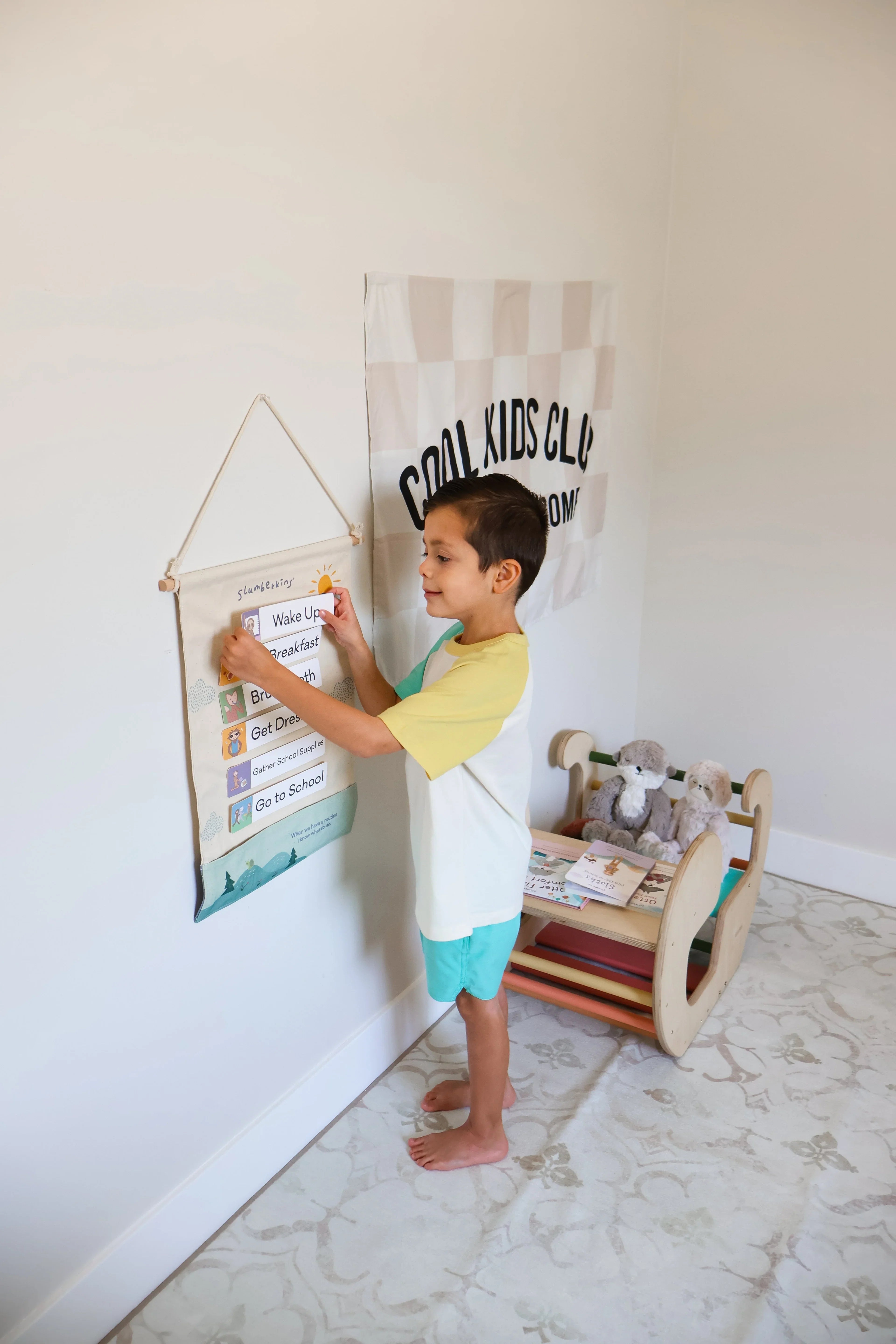 A little boy using a Slumberkins visual routine tool that guides children through daily activities and transitions