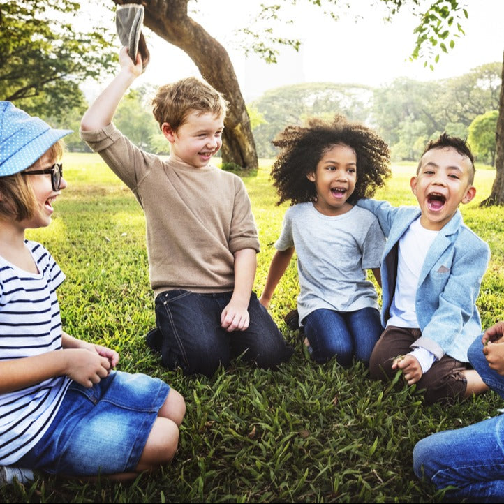 Kids playing cooperative games outdoors