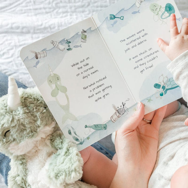 A caregiver reads Narwhal's Board Book to a child while Narwhal Kin joins, too!