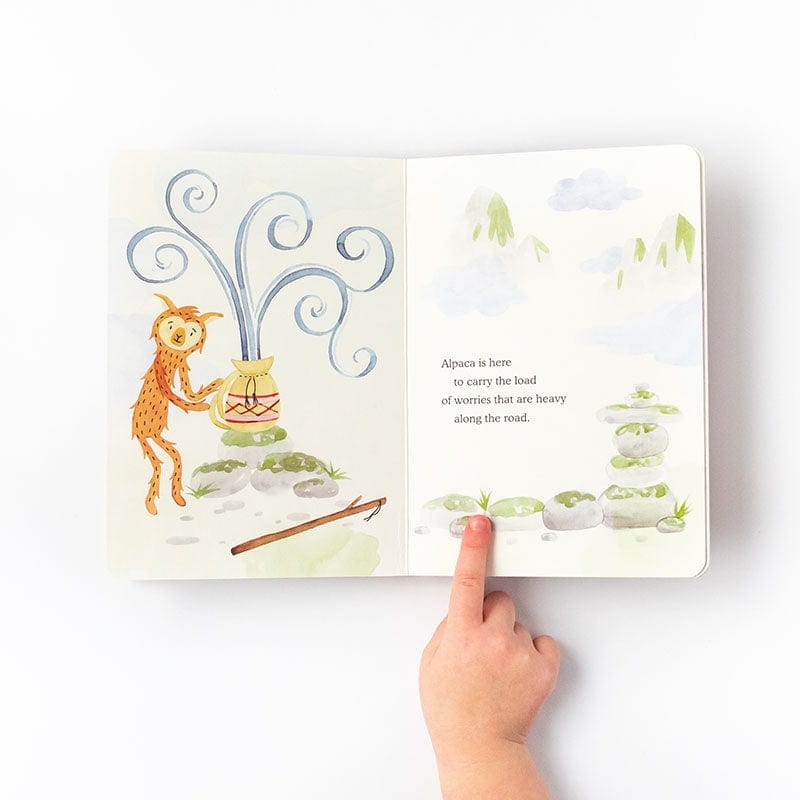 Alpaca Holds Your Worries Board Book open with child pointing to illustration - View Product