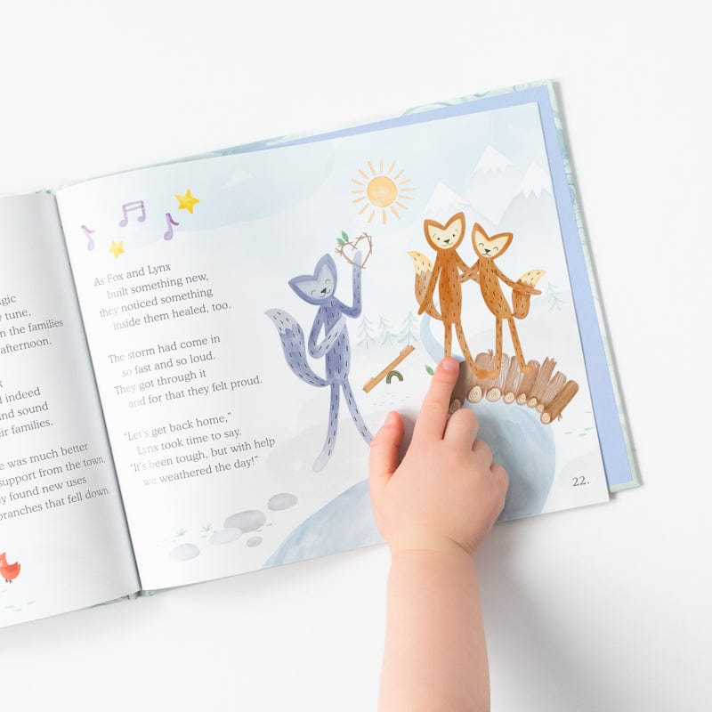 Weathering the Storm Hardcover Book open with child pointing to ilustration